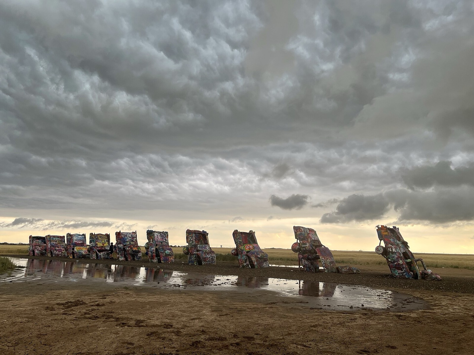 Storm clouds gathering over the Cadillacs at Cadillac Ranch